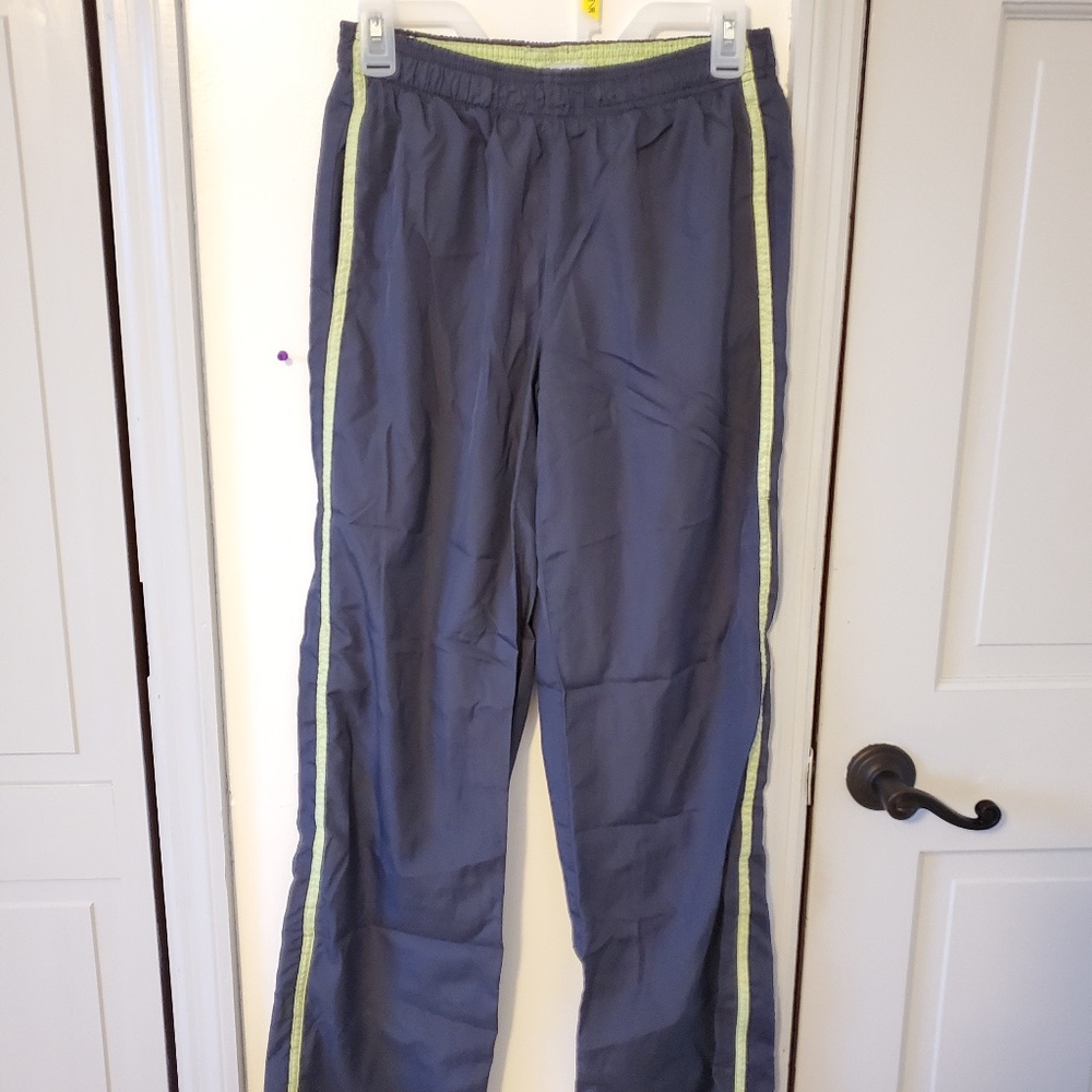 Dark grey track pants with neon green strip down both sides